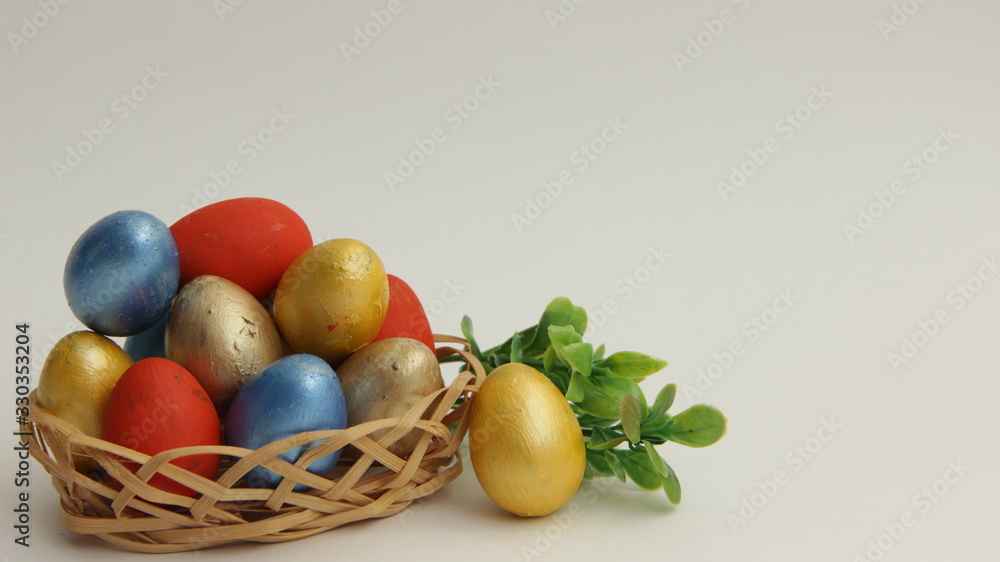 easter eggs in basket on white background easter eggs in basket on white background