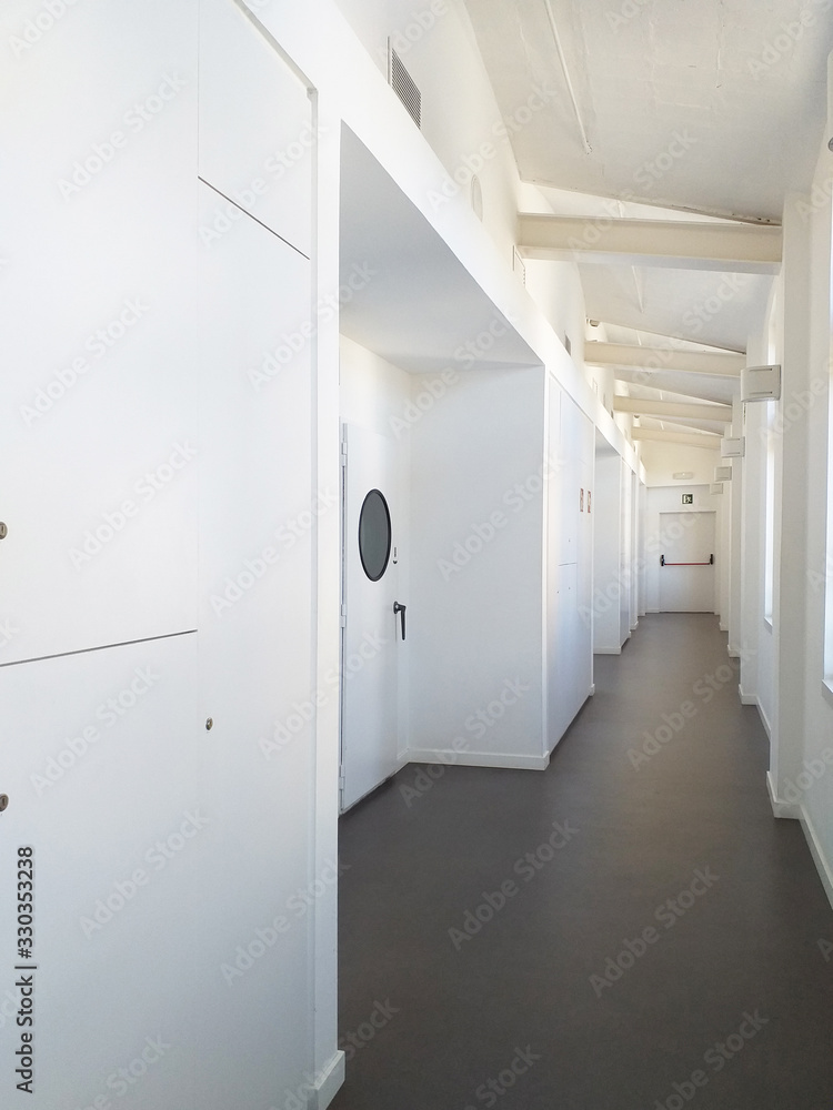 Long corridors of hospitals, offices in the hospital. Architectural and construction details. Modern and industrial design. Long corridors of hospitals, offices in the hospital. Architectural and construction details. Modern and industrial design.