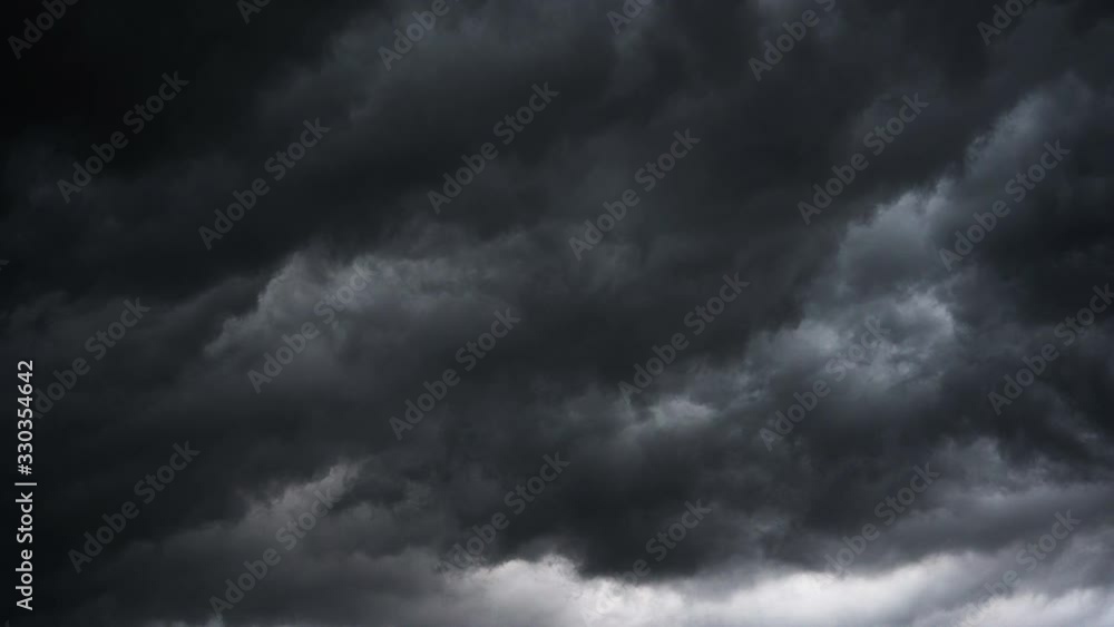 Dark ominous grey storm clouds. Dramatic sky. lighting in dark stormy clouds Dark ominous grey storm clouds. Dramatic sky. lighting in dark stormy clouds