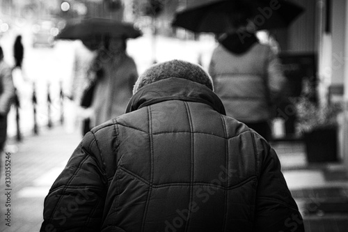 Old woman walking in the city