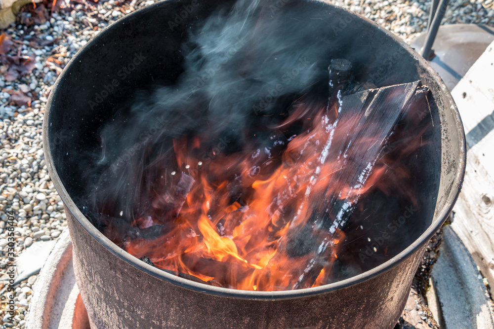 Burning barrel in the middle of the garden Burning barrel in the middle of the garden