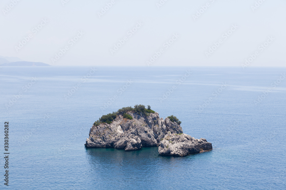 Naklejka premium Lonely island in the sea 