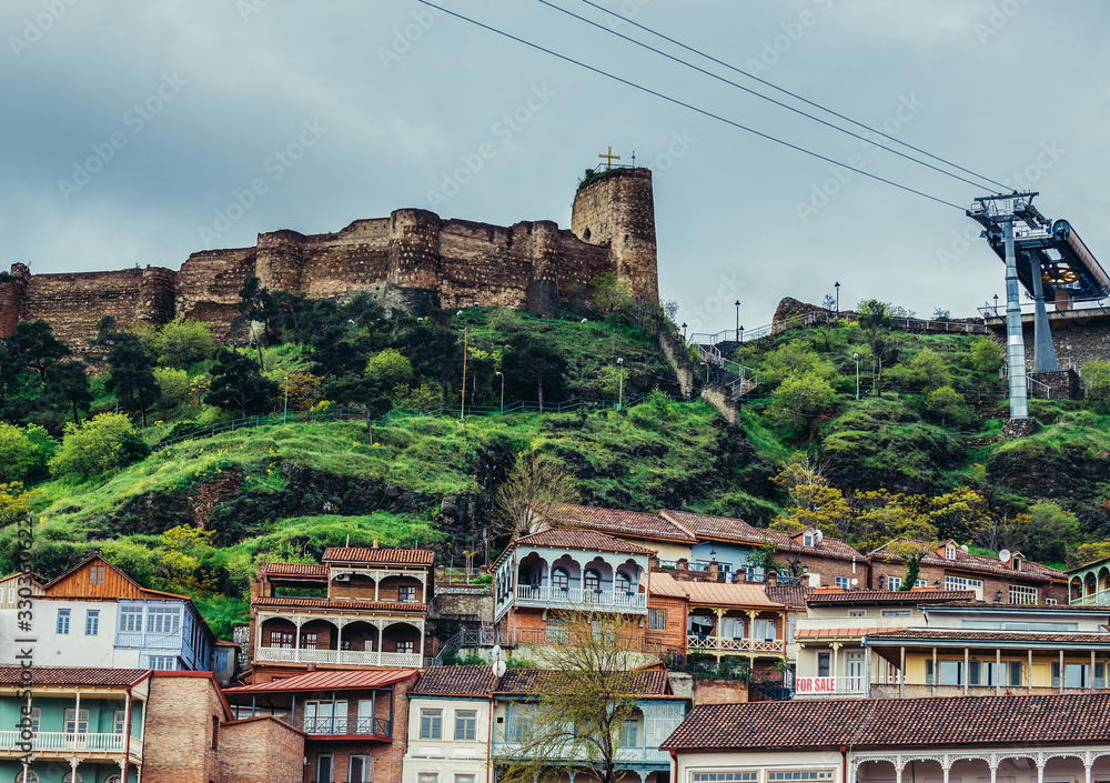 View on houses on the Old Town of Tbilisi. Narikala Fortress on background, Georgia