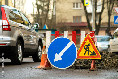 Warning street sign on road work site.