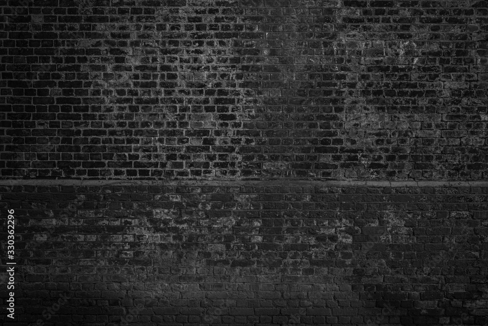 Obraz premium Old black and white brick wall background texture.