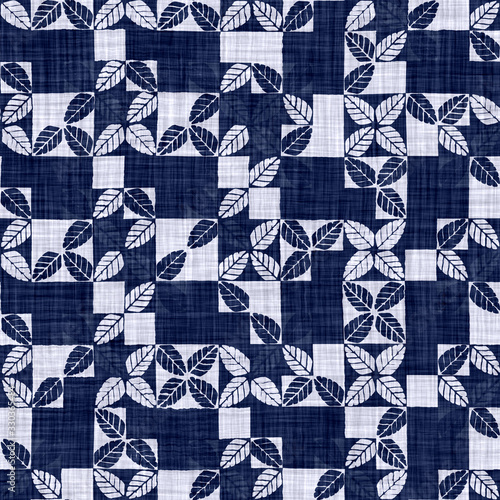 Seamless floral texture. Indigo blue woven boro cotton dyed effect background. Japanese repeat batik pattern swatch. Block print distress flower dye damask. Asian all over textile. Worn cloth print