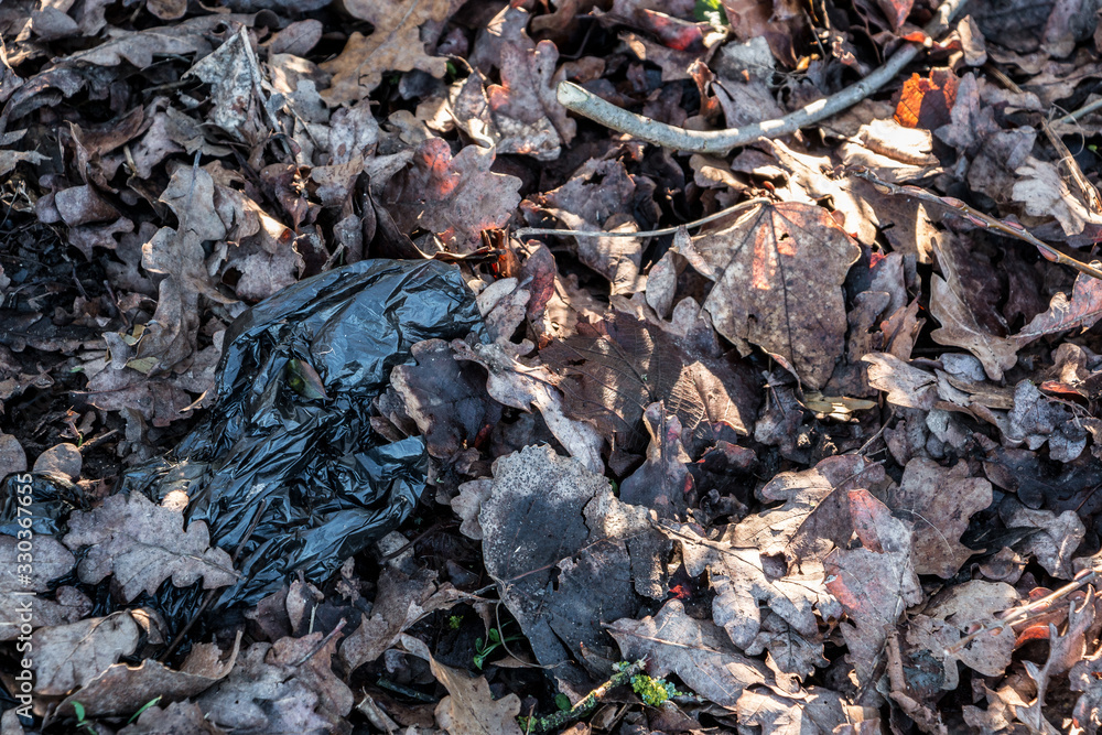 Plastic waste thrown away in the middle of nature