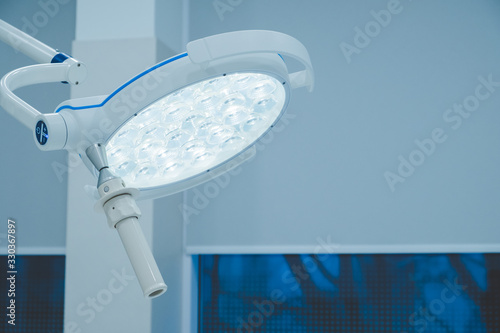 surgical lamps in operation room take with art lighting and blue filter. lighting fixture in a hospital operating room. Coronavirus, virus, operating room, laboratory photo