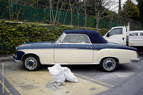 A classic vintage German car in the street