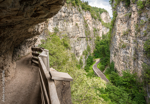 panoramic route to Sanctuary of San Romedio trentino, Trentino alto adige, northern italy  - Europe. Panoramic trail carved into the rock of the canyon photo