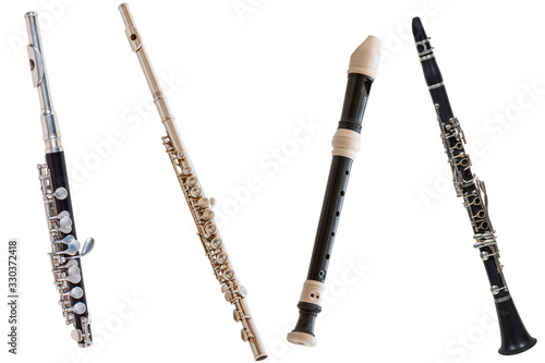 Canvas-taulu classical wind musical instrument flute-Piccolo, set of four flutes isolated on