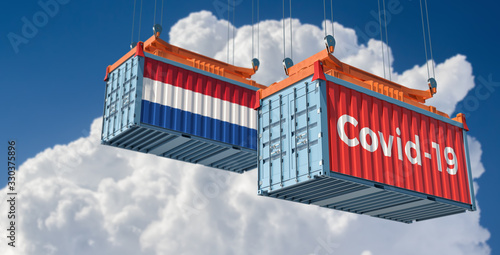 Container with Coronavirus Covid-19 text on the side and container with Netherlands Flag. Concept of international trade spreading the Corona virus. 3D Rendering © Marius Faust