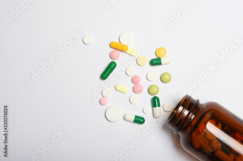 pills on a light background top view. Medicine, treatment, illness. Medication in tablets.