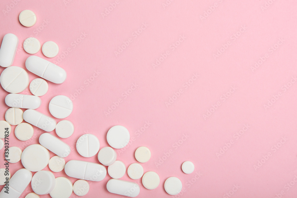 pills on a colored background top view. Medicine, treatment, illness. Medication in tablets. pills on a colored background top view. Medicine, treatment, illness. Medication in tablets.