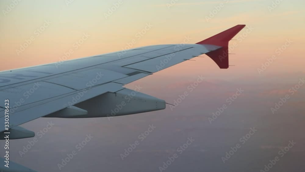 View From Airplane Window Of Wing Sunset Pink Sky Right To Left View From Airplane Window Of Wing Sunset Pink Sky Right To Left