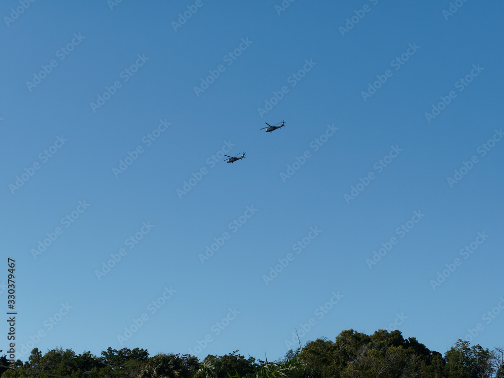 Silhouette Of two Helicopters at Clear Sky with tropical forest. Dominican Republic.. Silhouette Of two Helicopters at Clear Sky with tropical forest. Dominican Republic..