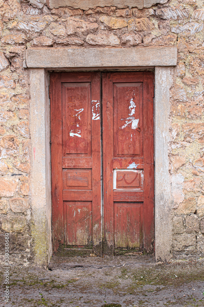 Old wooden doors rooted to the ground Old wooden doors rooted to the ground
