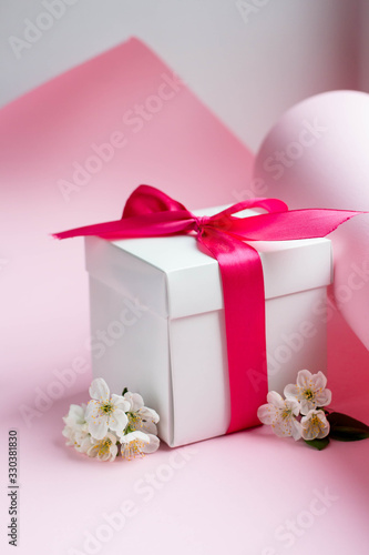 gift box with cherry blossom. present with spring bloomind photo