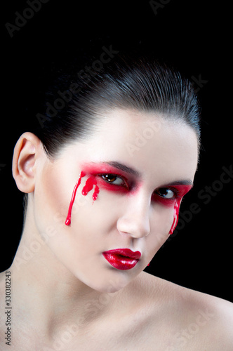 portrait of a girl with red tears