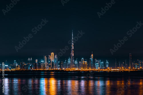 Dubai Skyline Taken at Night Showing Burj Khalifa and Dubai Downtown  Reflected on Dubai Creek