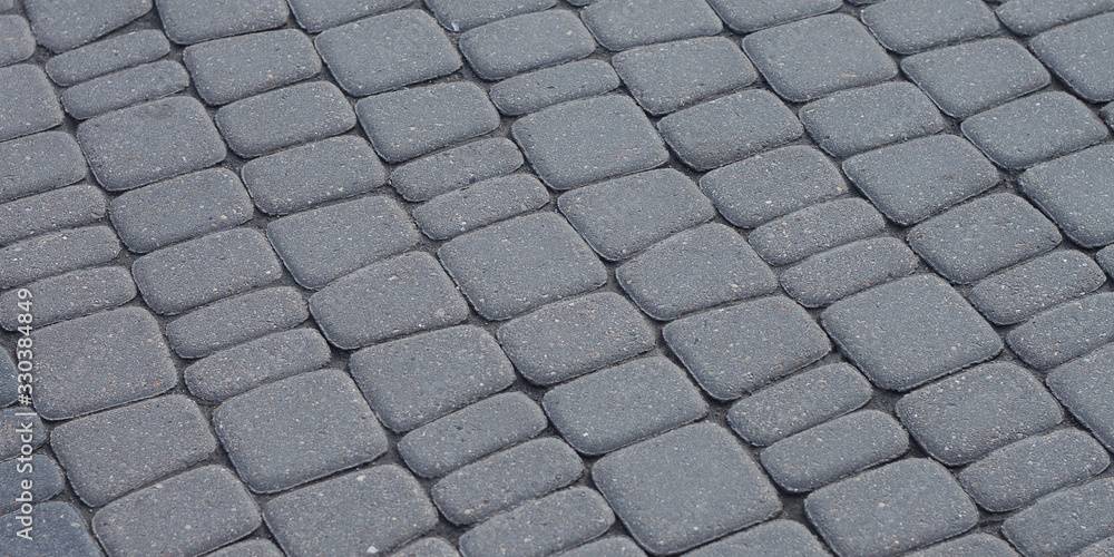 Fototapeta premium gray stylish paving stone creating a rhythmic pattern