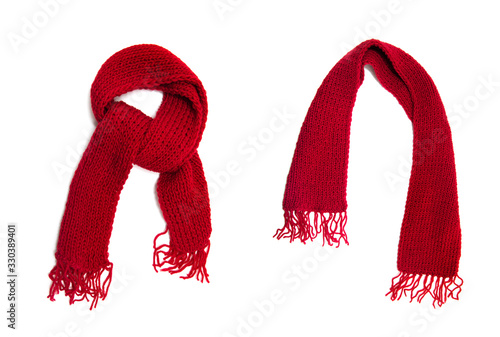 Red knitted scarf on a white background. photo