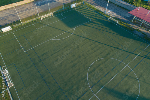 Oblique aerial view of an artificial grass football field