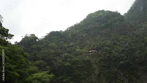 Asian Structure Built Into Mountainside Wide Shot photo