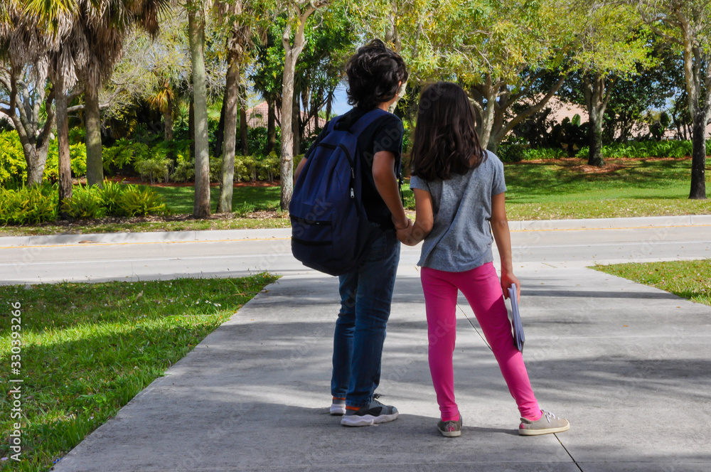 coronavirus kids school empty young boy girl waiting ride home pickup covid19 coronavirus kids school empty young boy girl waiting ride home pickup covid19