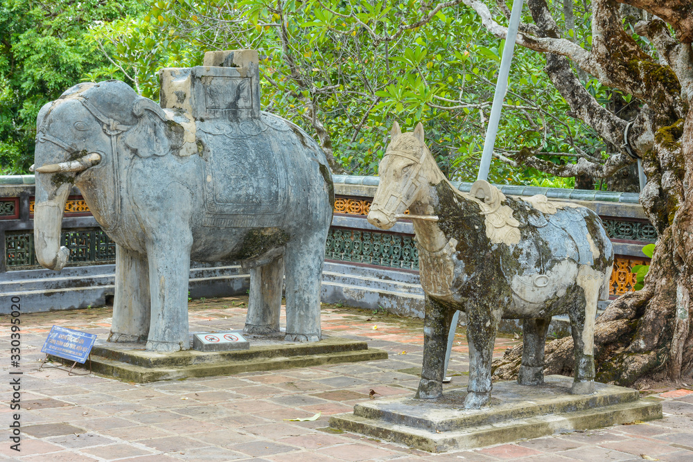 Elephant and horse sculptures in the Honour Courtyard of the Tomb of Tu Duc. Hue, Vietnam