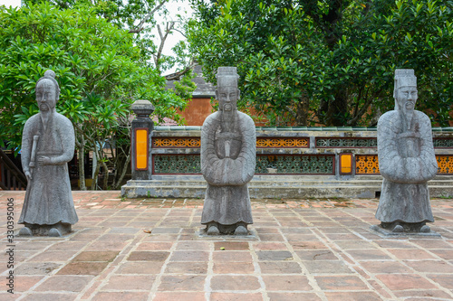 Mandarin Soldiers. Honour Courtyard of the Tomb of Tu Duc in Hue, Vietnam photo
