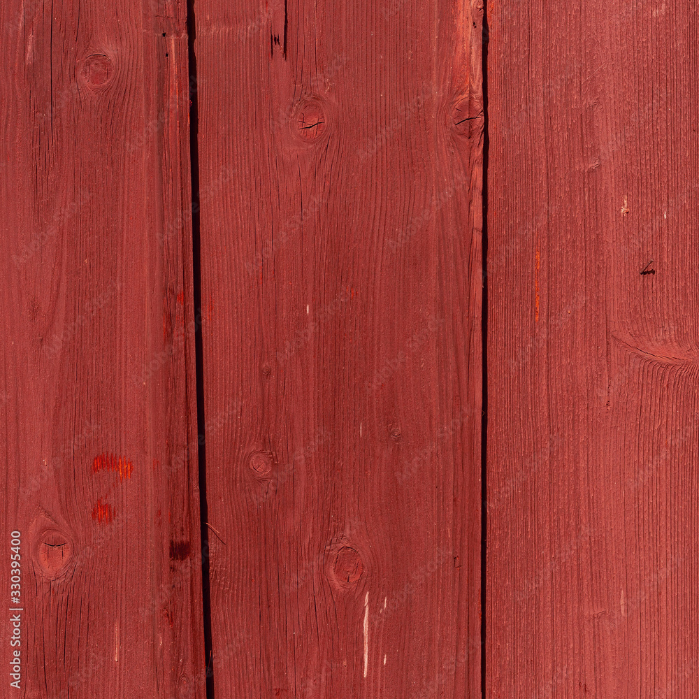 The old red wood texture with natural patterns The old red wood texture with natural patterns