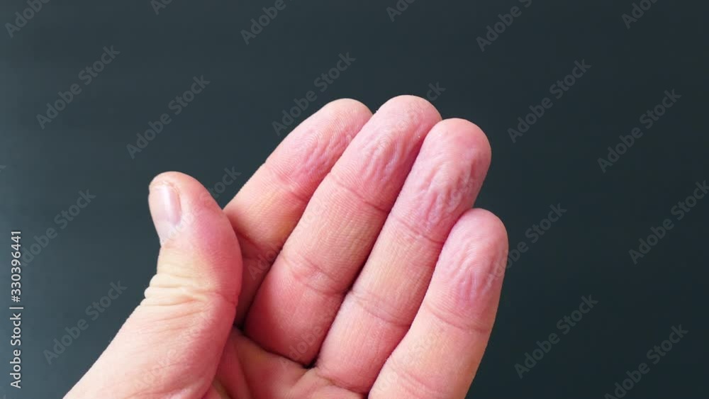 wrinkles of fingers left in the water, wrinkled fingertips due to water