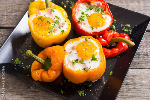 Baked pepper stuffed with bacon and eggs