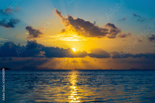 Beautiful sunset over the sea water on the island of Koh Phangan  Thailand. Travel and nature concept