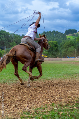 man riding a horse at a Creole rodeo "rodeio crioulo" © Walter