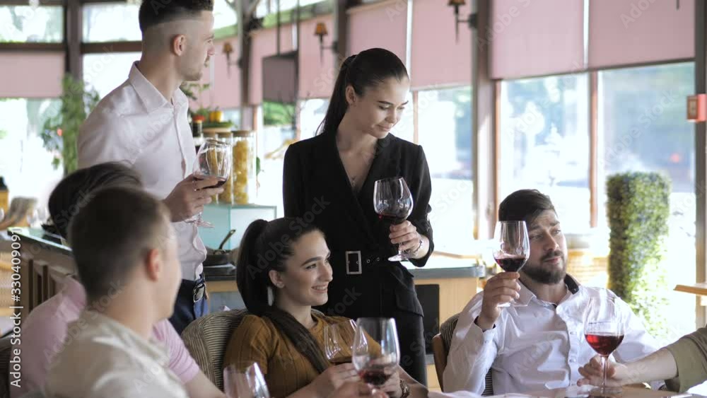 Young friends having fun in the restaurant drinking red wine. Youth friendship concept Young friends having fun in the restaurant drinking red wine. Youth friendship concept
