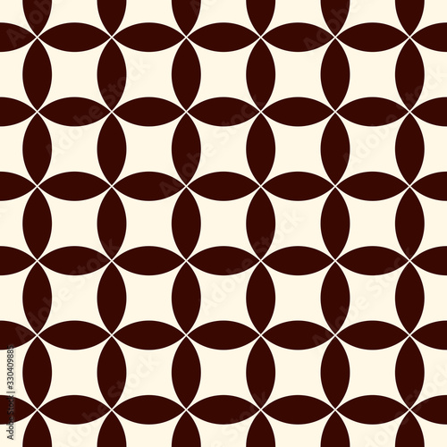Brown abstract background with overlapping circles. Petals motif. Seamless pattern with classic geometric ornament