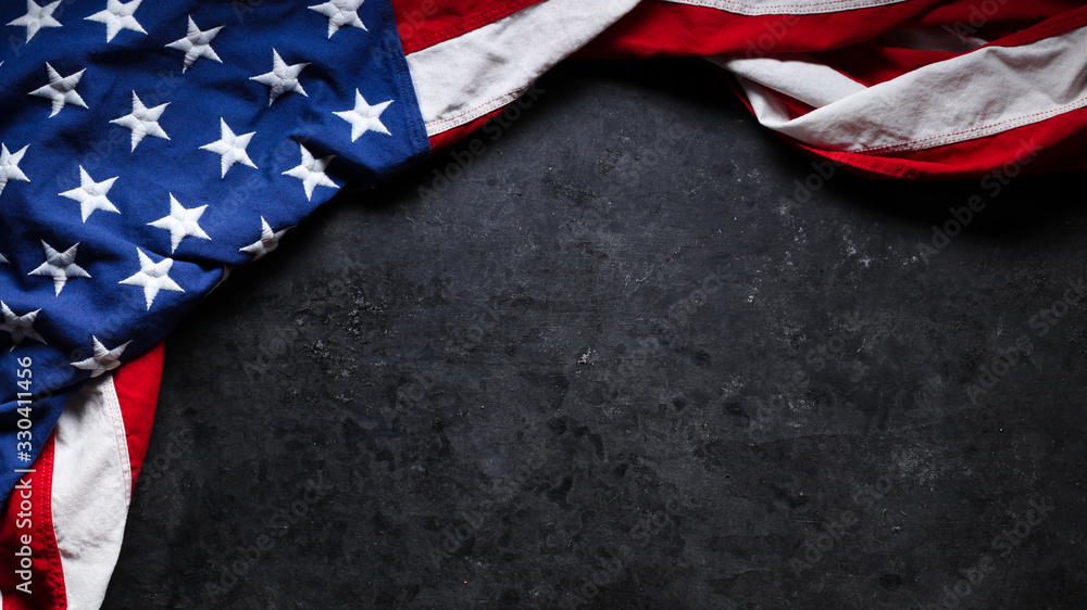 US American flag on worn black background. For USA Memorial day, Veteran's day, Labor day, or 4th of July celebration. With blank space for text. US American flag on worn black background. For USA Memorial day, Veteran's day, Labor day, or 4th of July celebration. With blank space for text.