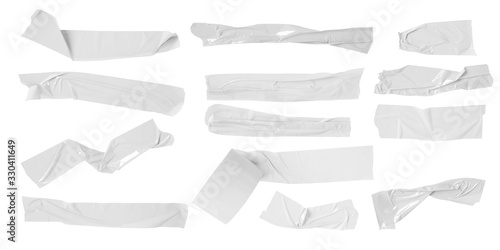 Set of white scotch tapes on white background. Torn horizontal and different size white sticky tape, adhesive pieces.