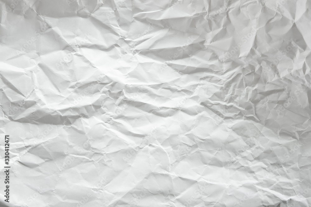 Naklejka premium white and gray crumpled paper texture background. crush paper so that it becomes creased and wrinkled.