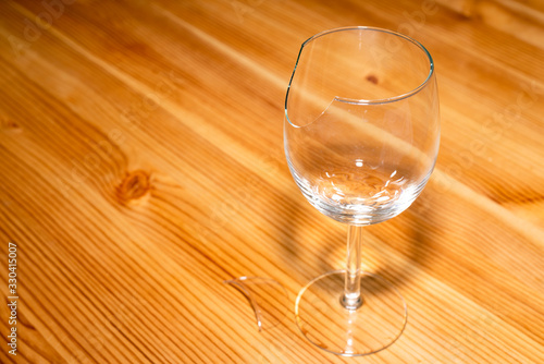 There is a broken wineglass on the table