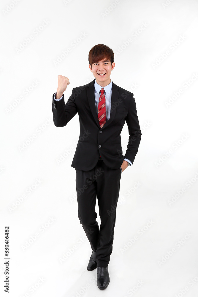Young smart handsome Asian man business office wearing suit tie on white background walk forward fist up joy success Young smart handsome Asian man business office wearing suit tie on white background walk forward fist up joy success