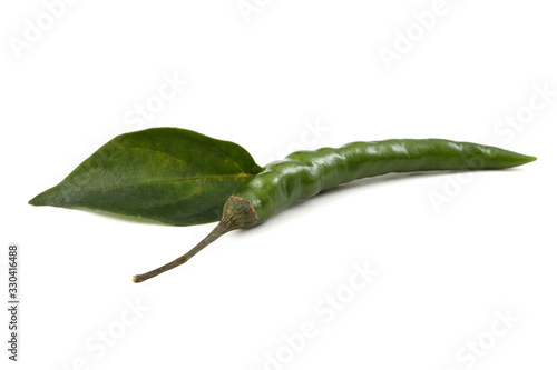 Green hot chili pepper and leaves