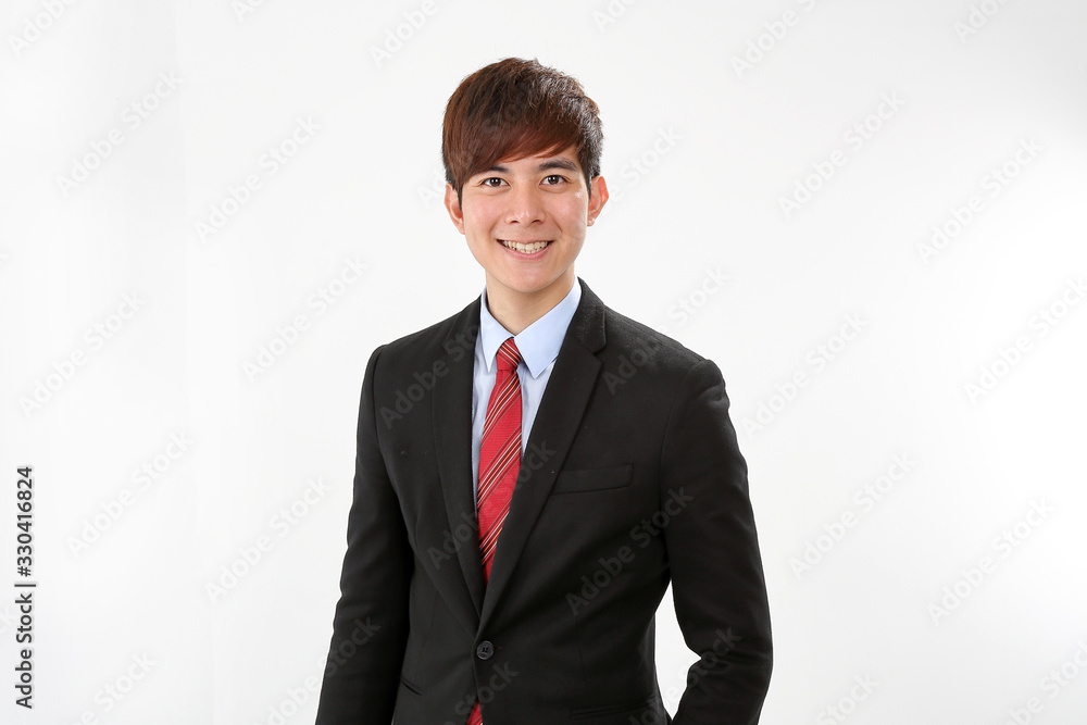Young smart handsome Asian man business office wearing suit tie on white background stand pose confident look at camera smile text space Young smart handsome Asian man business office wearing suit tie on white background stand pose confident look at camera smile text space