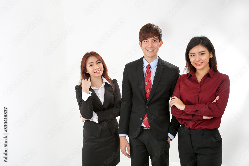Young attractive one man two woman business office white background stand pose confident look at camera smile Young attractive one man two woman business office white background stand pose confident look at camera smile