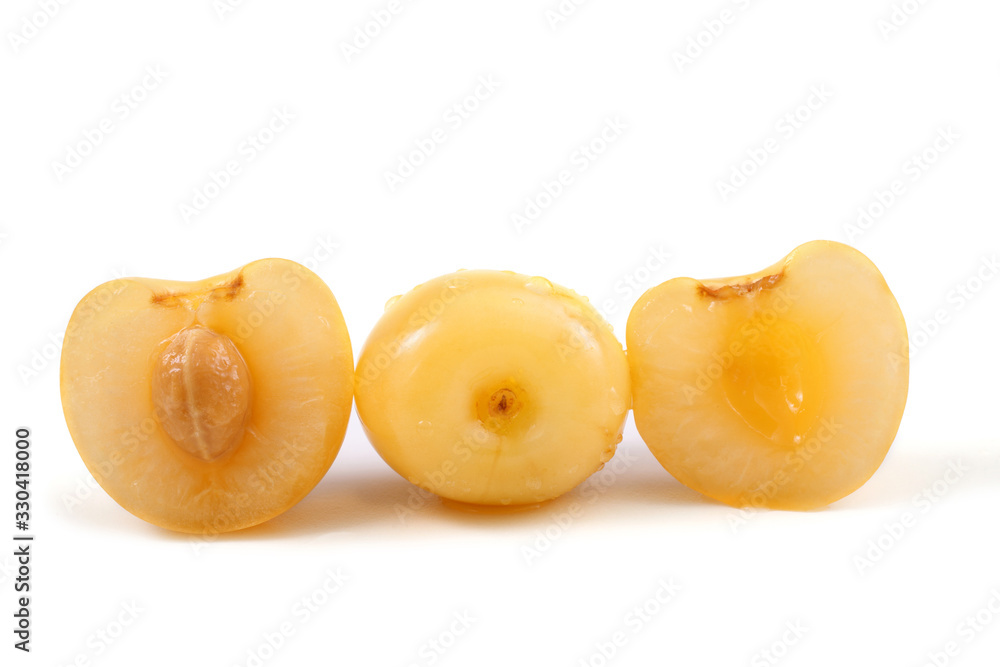 Yellow cherries with a half