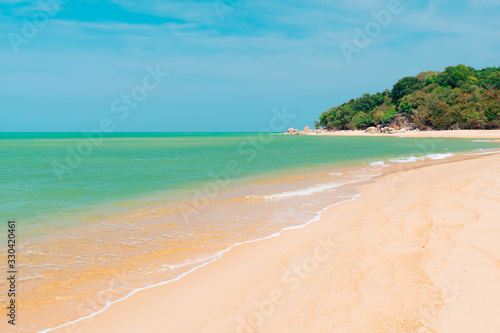 Fototapeta Naklejka Na Ścianę i Meble -  Tropical nature clean beach and white sand in summer with sun light blue sky and bokeh background.