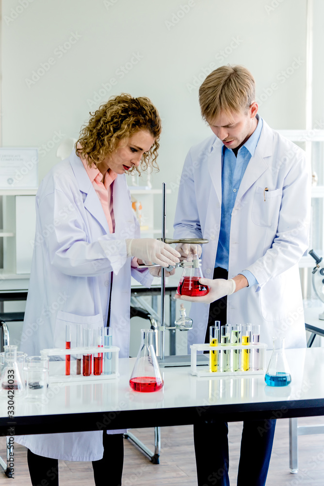 Scientists working in laboratory Scientists working in laboratory