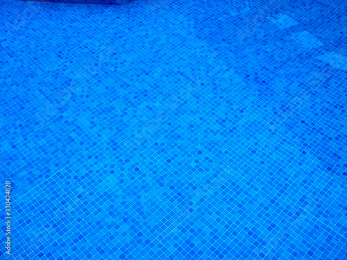 Blue ripples in the water of a swimming pool